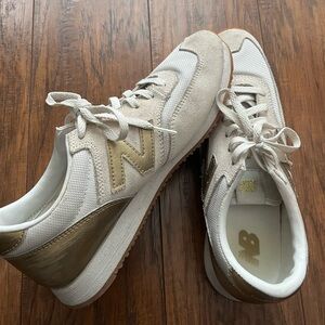 New Balance gold accent sneakers